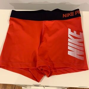 Nike pros! Red/orange color. Spandex.